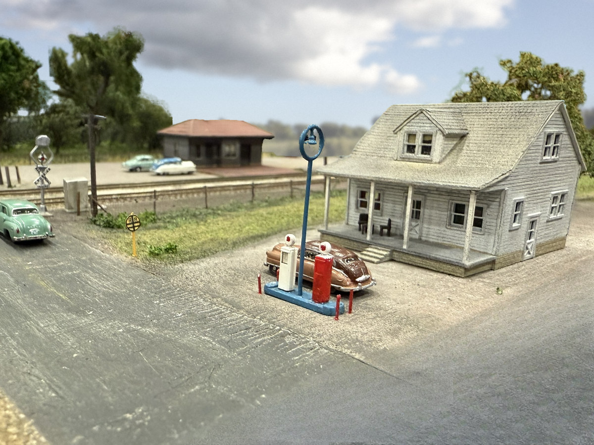 Gas pumps and a house across the road from the Oakwood depot